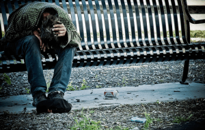 distraught man on a bench